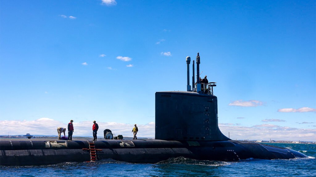 Australia says Aukus submarines remain on schedule, while critics cite US shipbuilding limits and laws that may prevent any future transfer.

