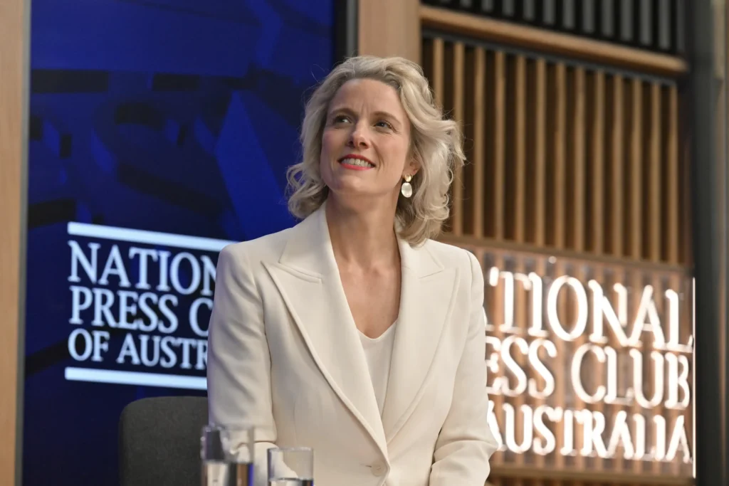 Clare O'Neil smiling while seated at the National Press Club of Australia